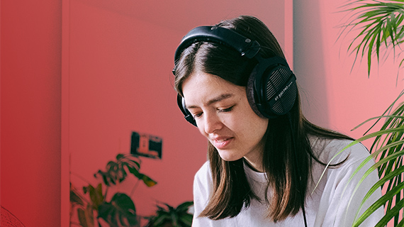 Create a remix of one of your favorite songs Woman with headphones