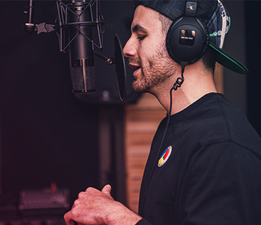 Record a podcast A close-up of a man speaking into a microphone