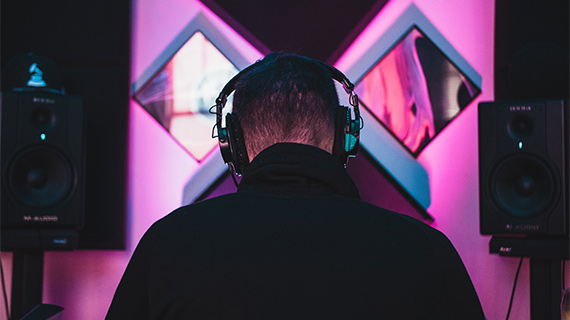 Create your own song in just 6 steps Rear shot of a person wearing headphones