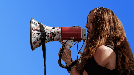 A woman with a megaphone to illustrate the audio dubbing in postproduction
