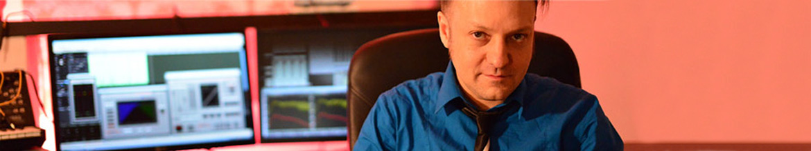 Bob Humid in front of his desk